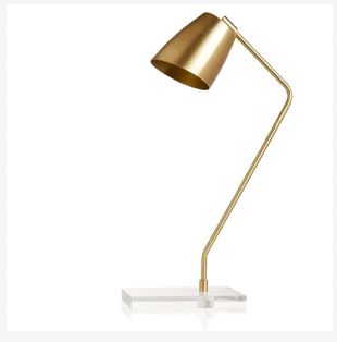 Skitty desk lamp in brass with an acrylic base