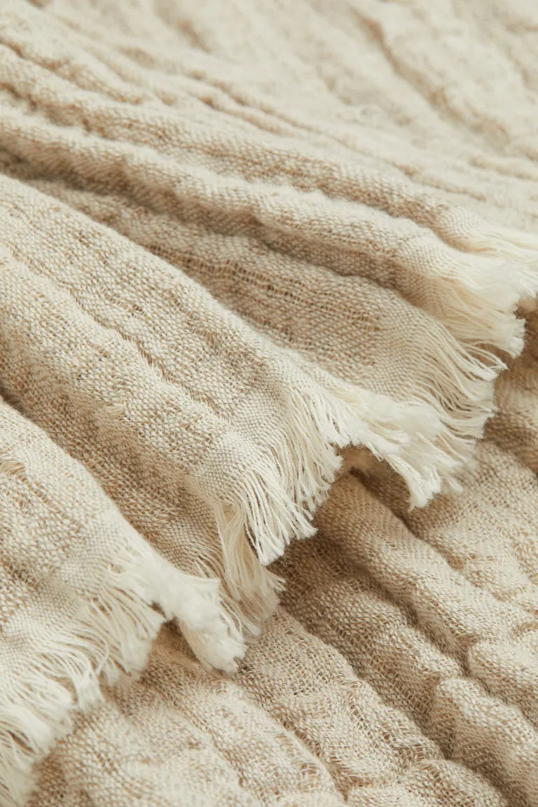 Crinkled linen-blend blanket