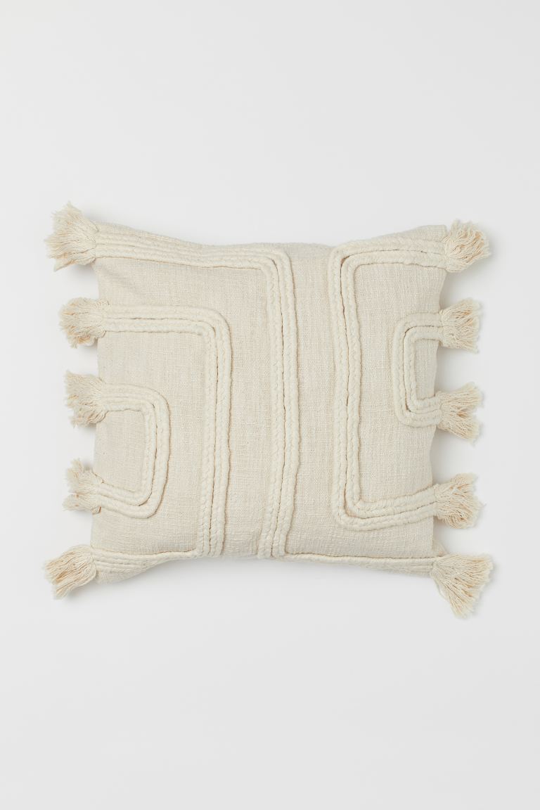 Tasselled cushion cover