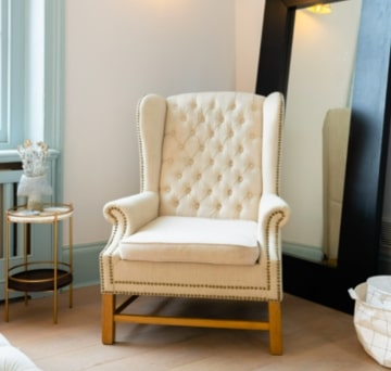 Grand Wingback armchair in natural linen & brass studs